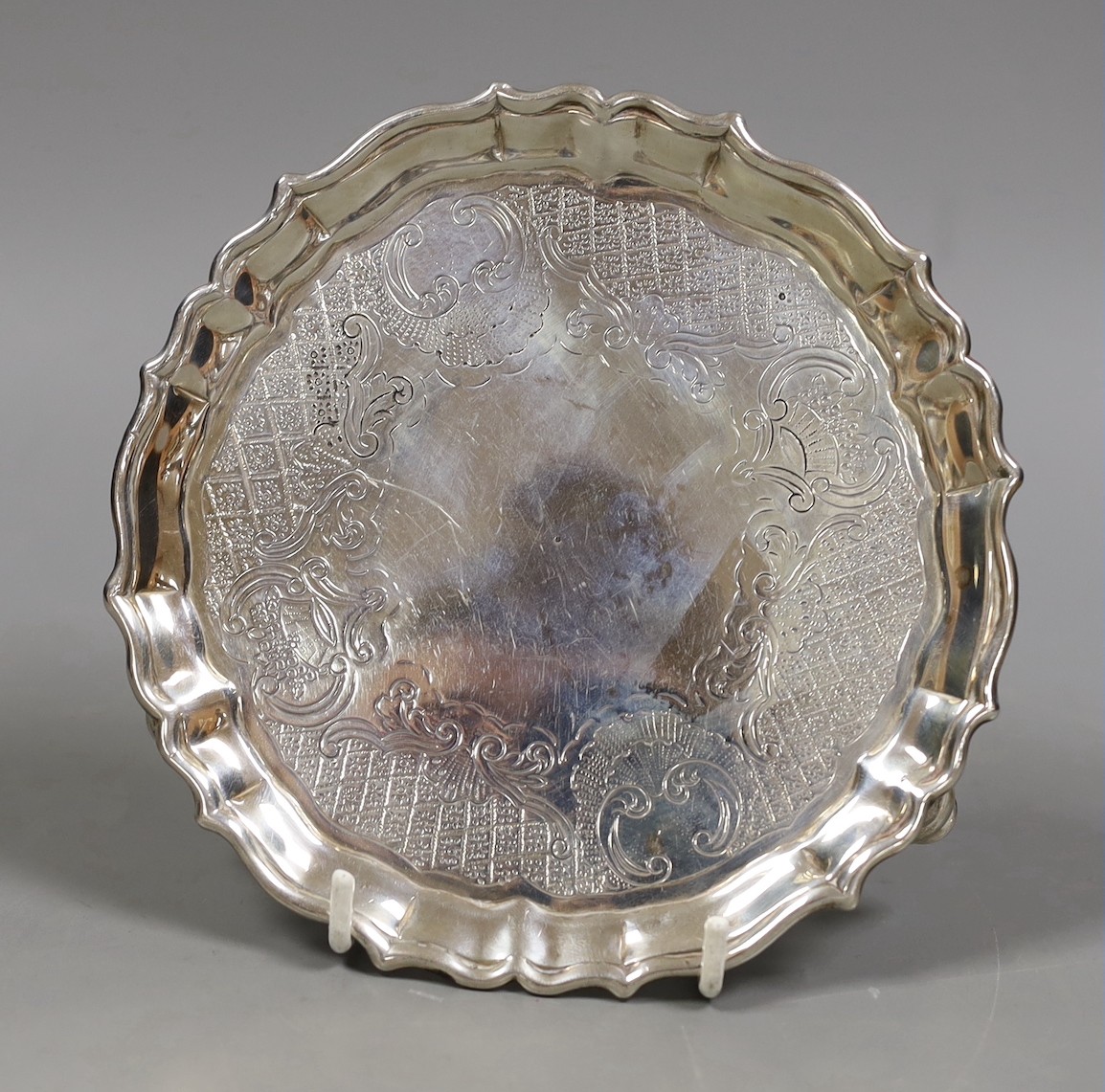 A George II silver waiter, with later? engraved decoration, indistinct maker's mark, London, 1736, 15.3cm, 7.5oz.